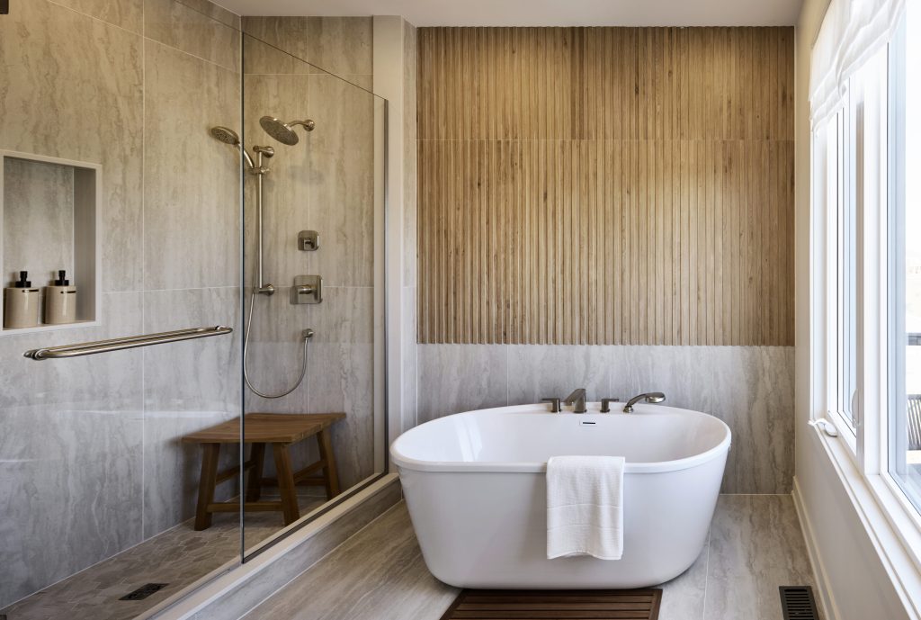 The Hemlock model home: bathroom with a freestanding tub, walk-in shower and slatted wood wall