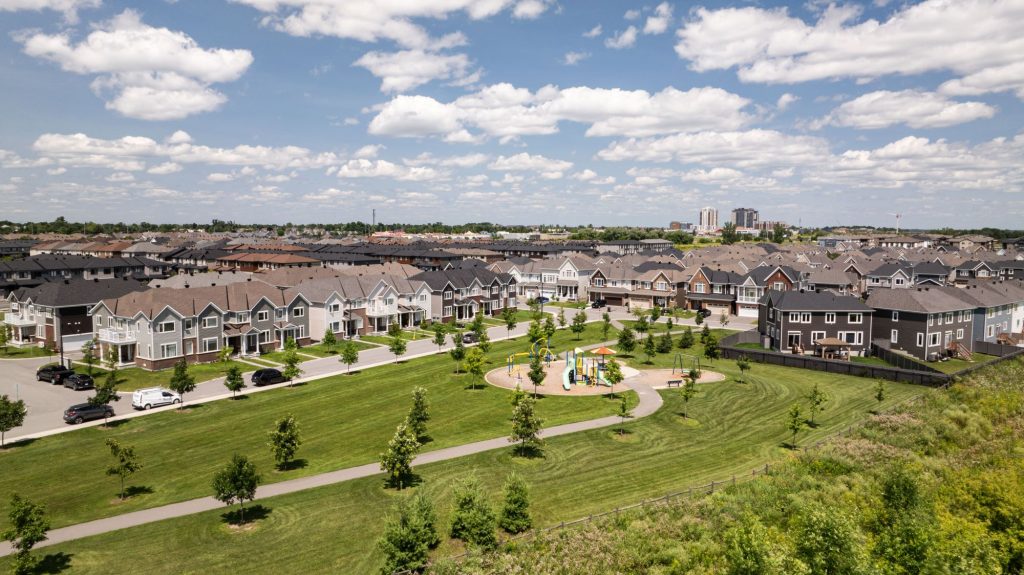 Aerial view of The Conservancy in Barrhaven, looking across the parkland to the homes