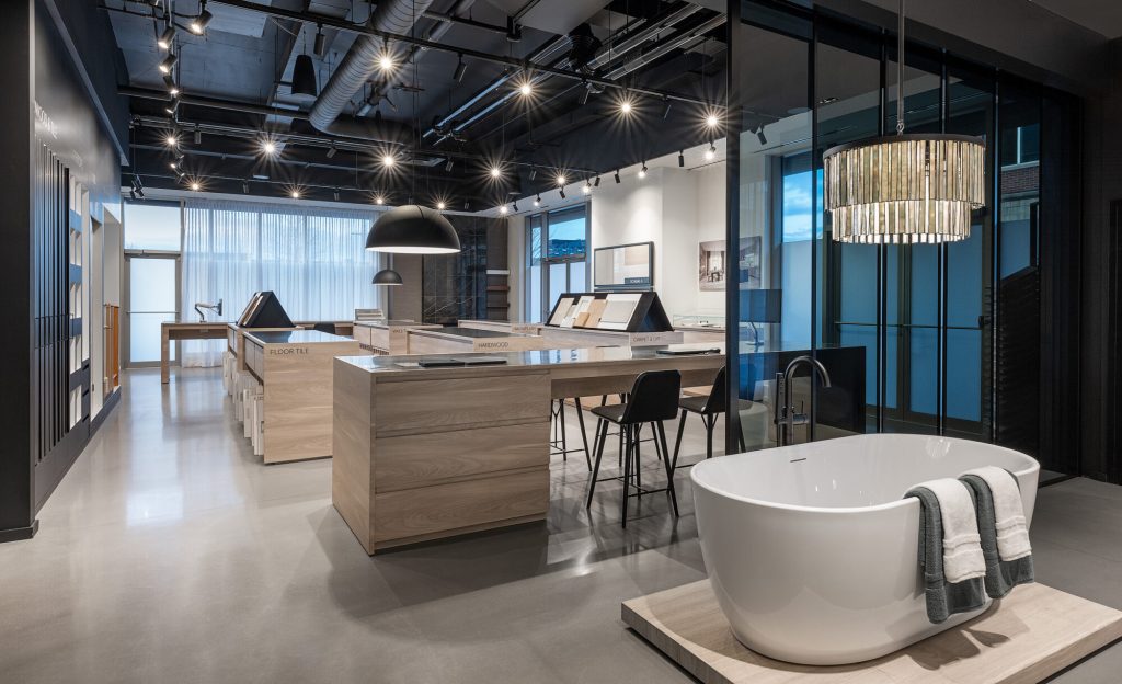 Design Studio showroom floor, with a wood-topped island, pendant lighting and a display tub