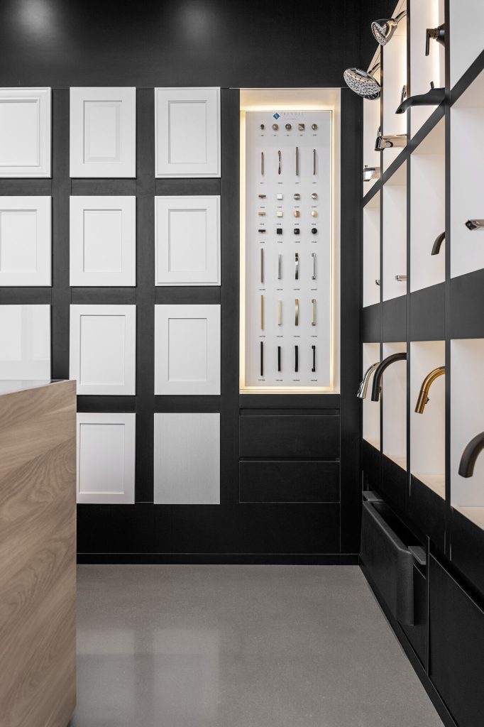 Display wall of cabinet doors, handles and trim samples in the Design Studio