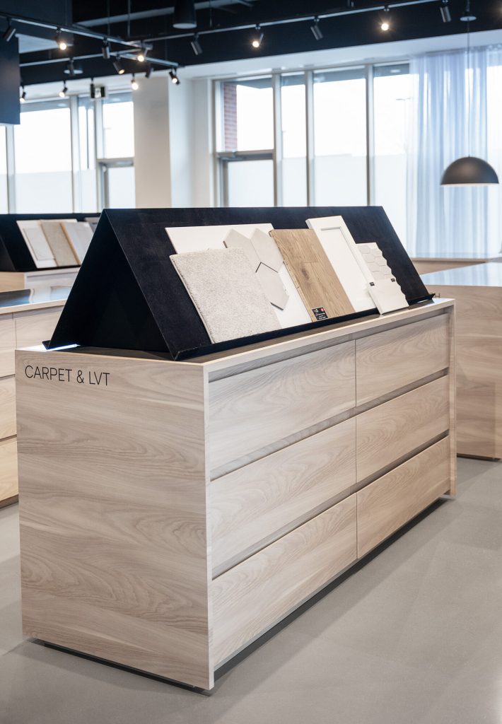 Angled display case of carpet and flooring samples in the Design Studio