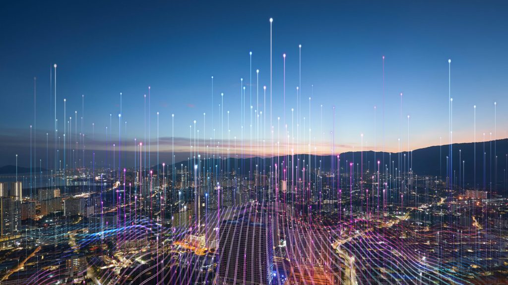 A city skyline at dusk, overlaid with points of light