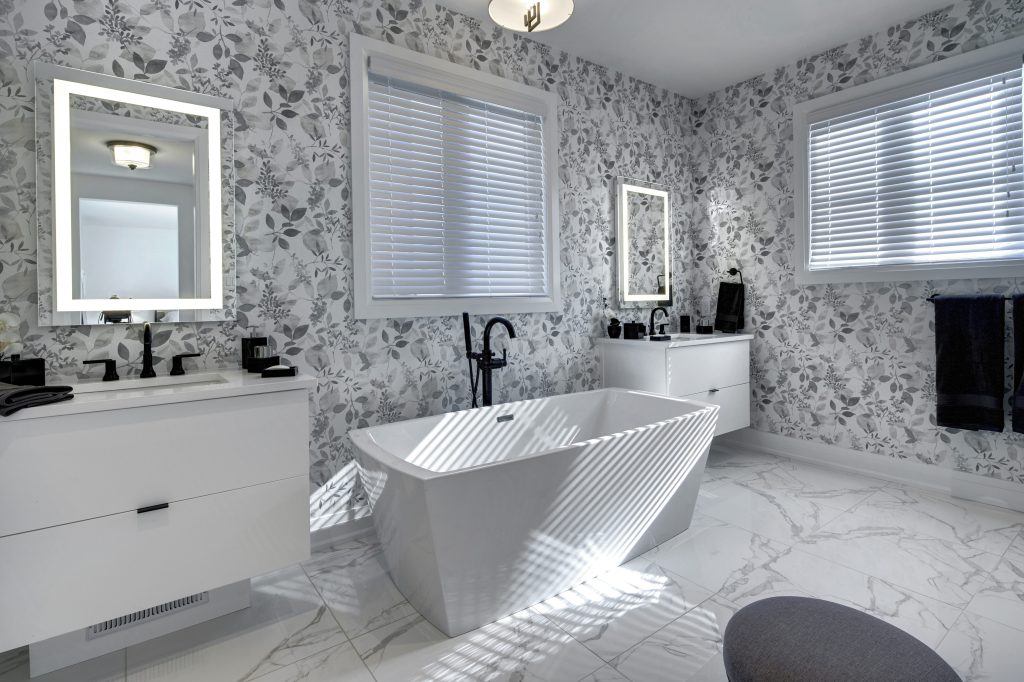 Series III Plan 2 model home: bathroom with a freestanding tub and patterned wallpaper