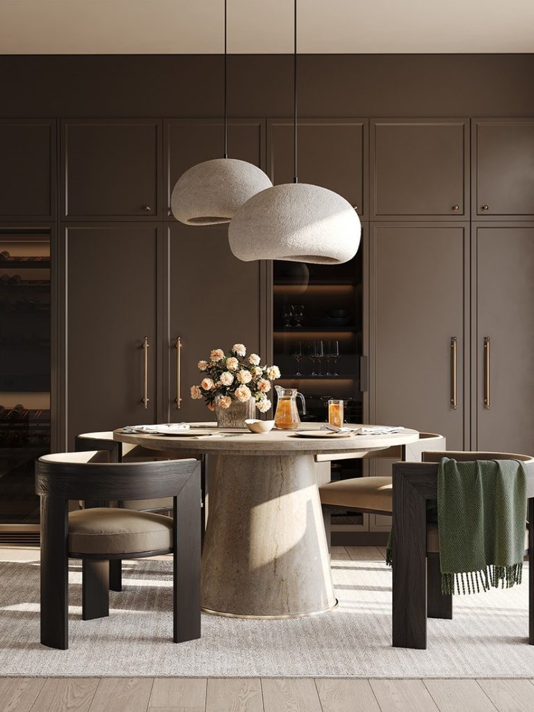 Riverview dining room with a round table, sculptural pendants and full-height cabinetry
