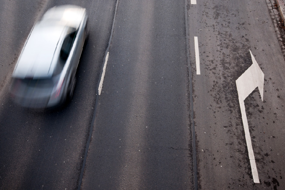 A car on a highway, seen from above