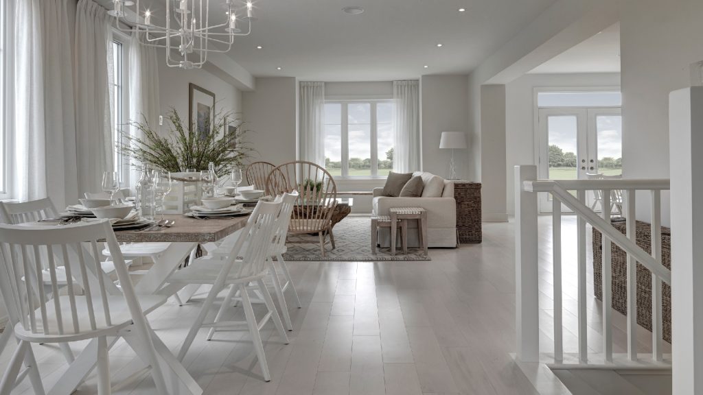 Series II Plan 2 at Fox Run: dining table set beside an open living area