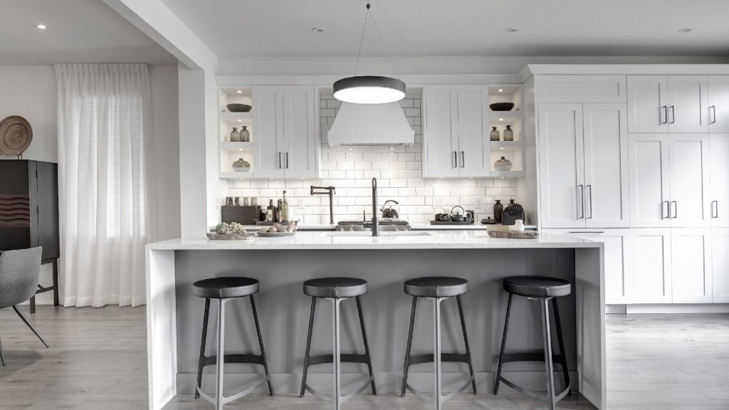 Series III Plan 2 at Fox Run: white kitchen with a long island and bar stools