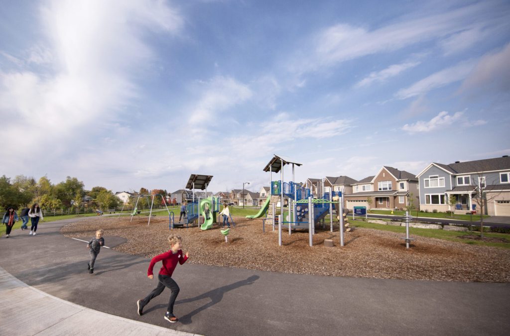 Children running and playing at a neighbourhood playground