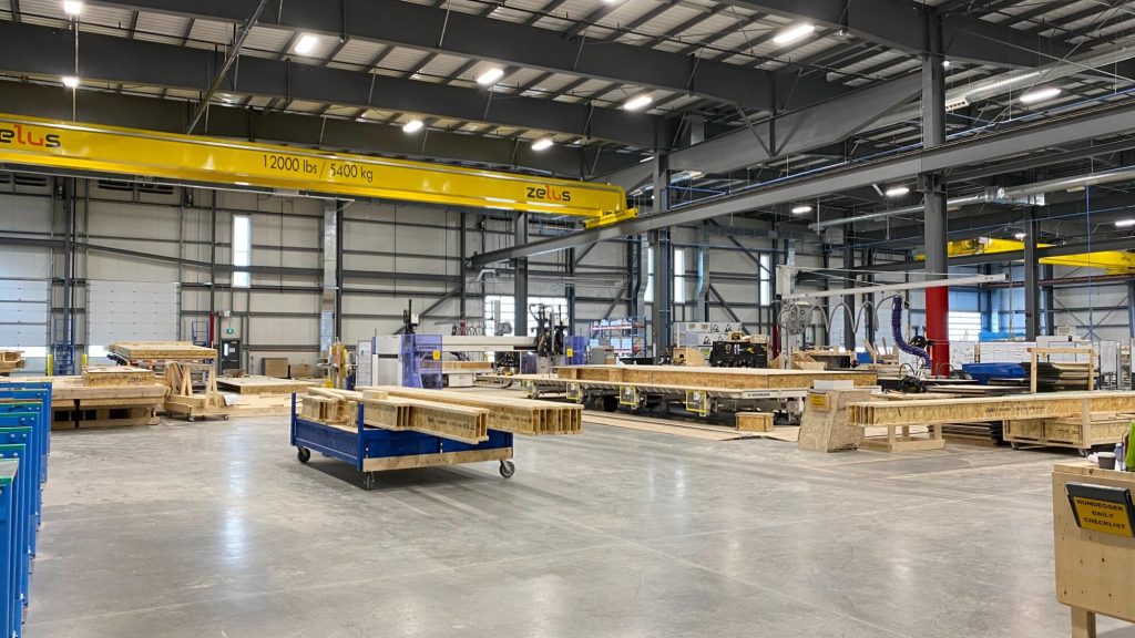 Caivan's manufacturing plant, with overhead cranes and timber assembly lines