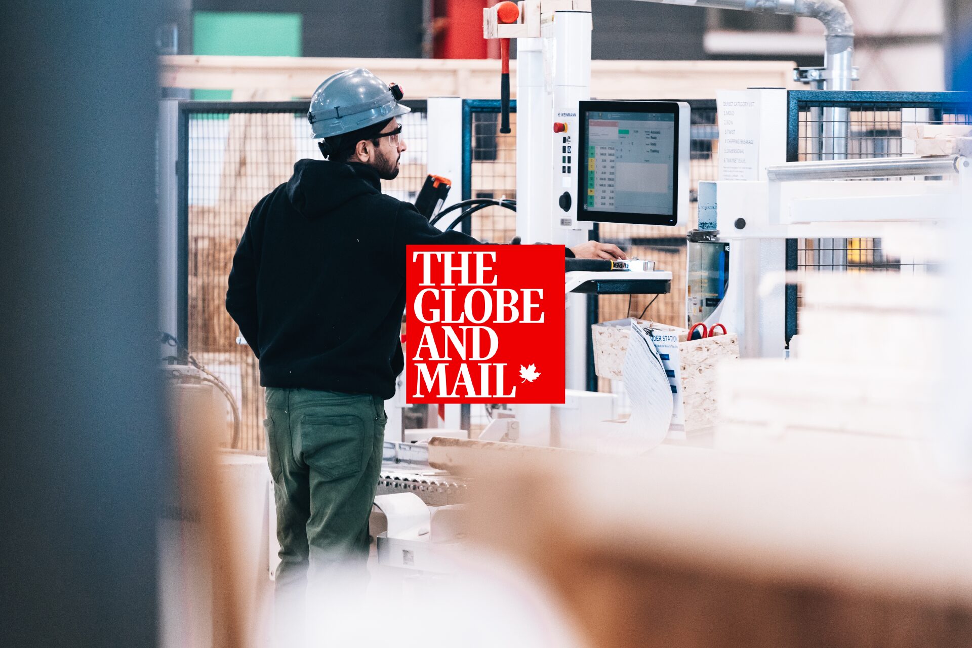 A worker at a factory control panel, beside The Globe and Mail masthead