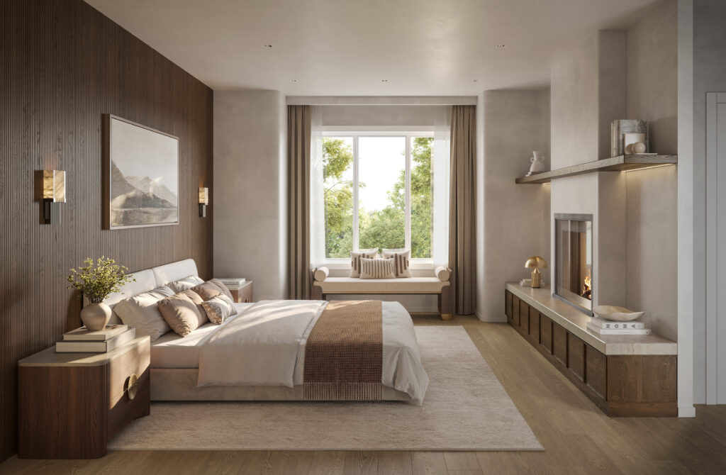 Primary bedroom at Five Oaks, with a wood-panelled wall, a fireplace and a window seat
